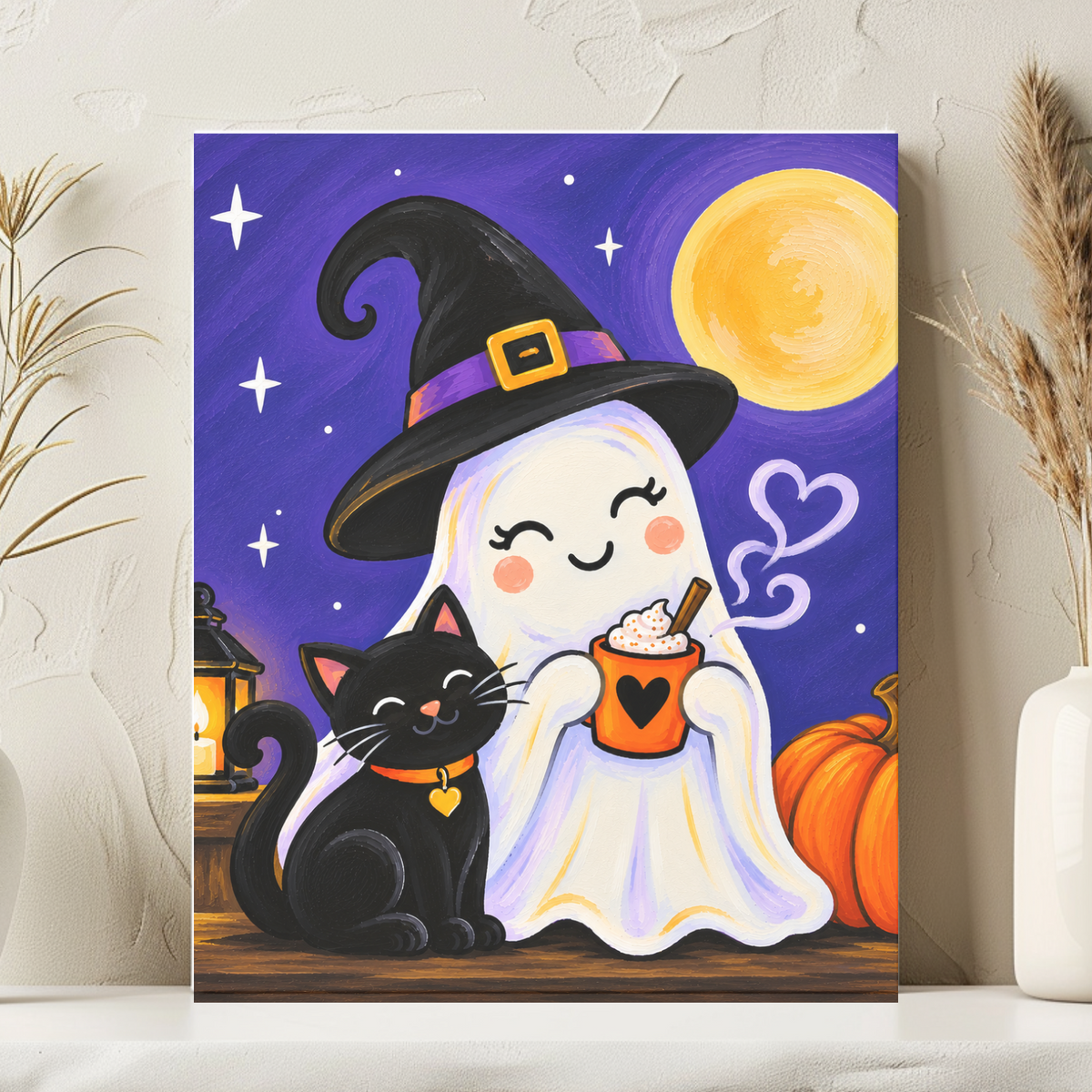A vertical Halloween-themed art print leaning against a textured wall on a white surface, flanked by two white vases with dried grass. The artwork shows a smiling ghost in a witch hat holding an orange mug, with a black cat, pumpkins, stars, and a yellow moon on a purple background.